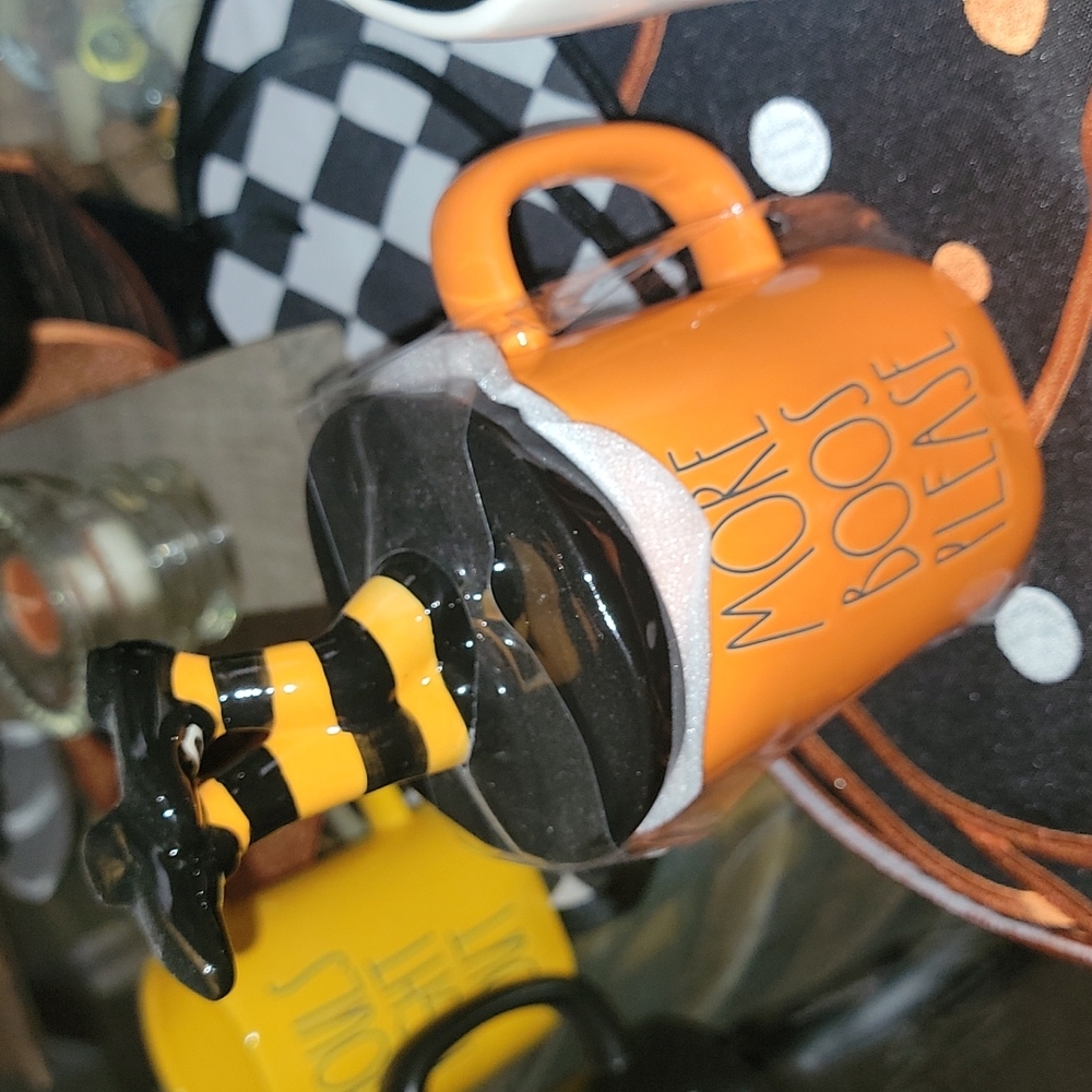 Rae dunn mug with collectible witch legs topper,  adorable! Orange and black